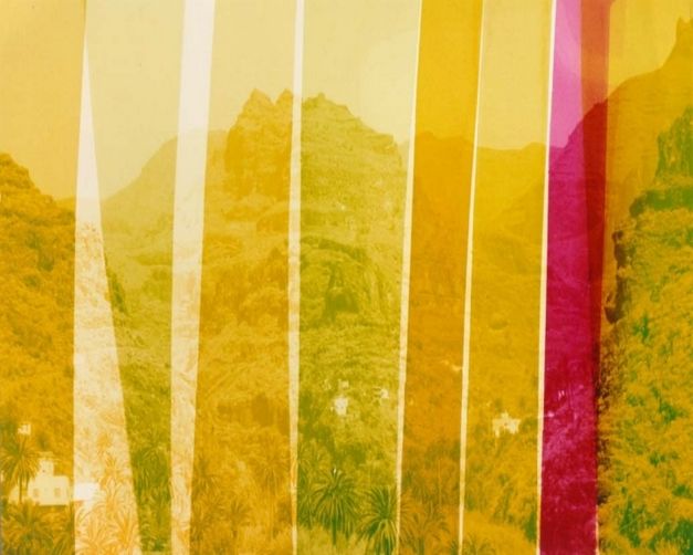 Film still from LOST: You can see stripes in various shades of yellow laid over a mountainous landscape.