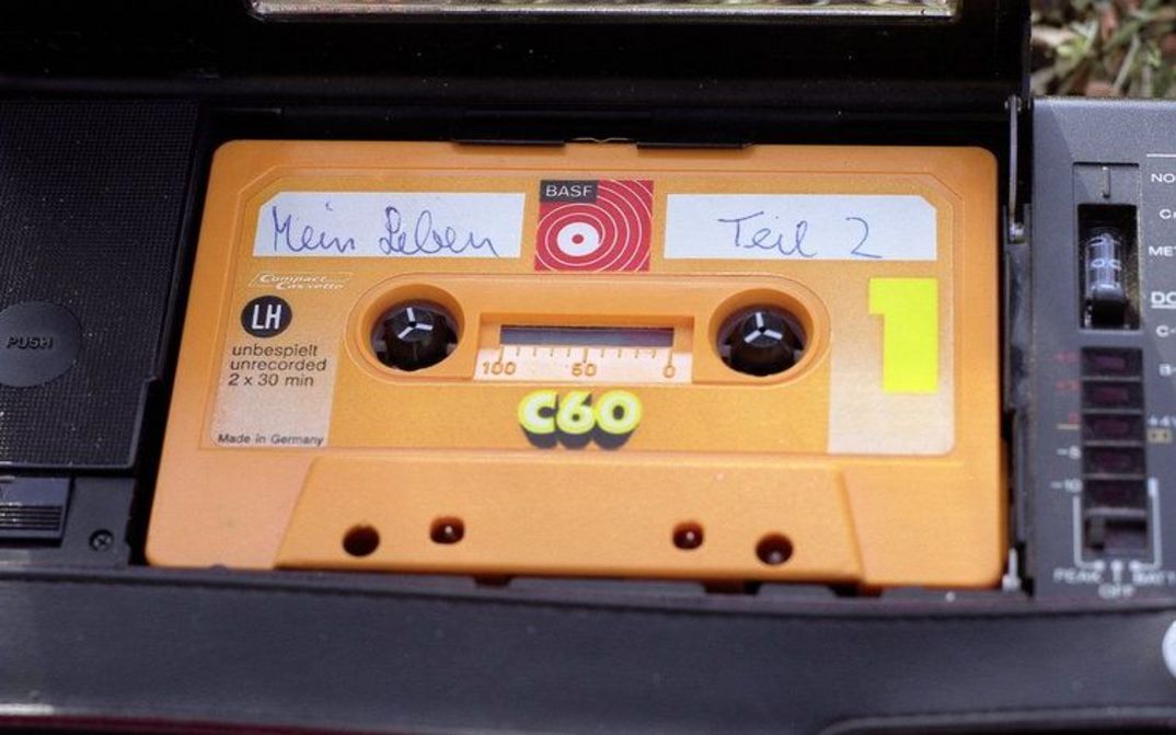 Film still from MEIN LEBEN TEIL 2: An audio cassette labeled "My life part 2".