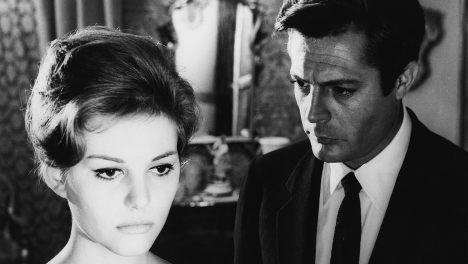 Film still from IL BELL'ANTONIO: A man looks thoughtfully at the woman standing next to him.