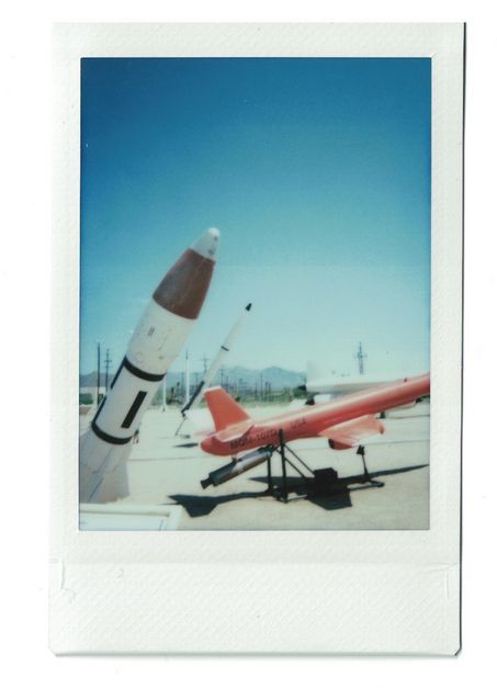 Polaroid of missiles as part of a display.