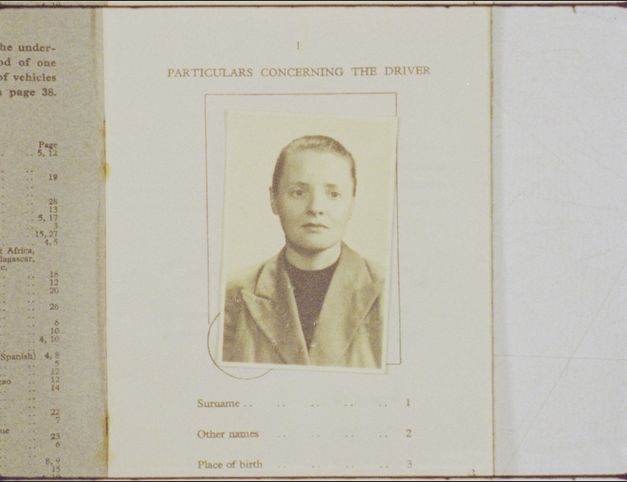 Filmstill from "Being in a Place – A Portrait of Margaret Tait" by Luke Fowler. Close up of old driver license with photo.