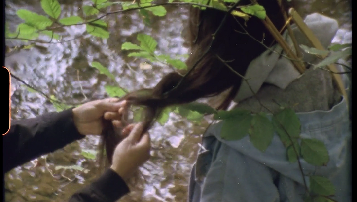 Filmstill from REROOTING by the Post (Film) Collective