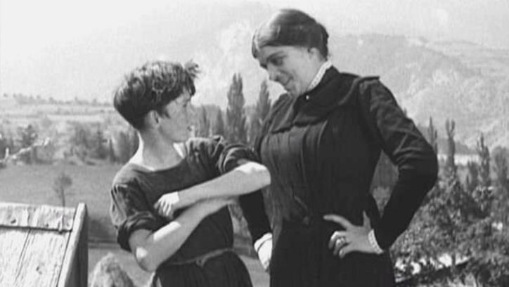 Film still from POIL DE CAROTTE: A woman scolds a boy.