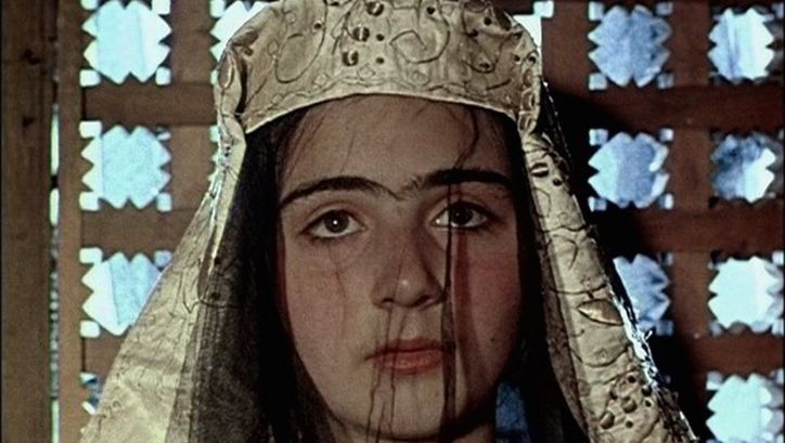 Film still from ASHIK KERIB: A young woman with an elaborate headdress.