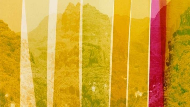 Film still from LOST: You can see stripes in various shades of yellow laid over a mountainous landscape.