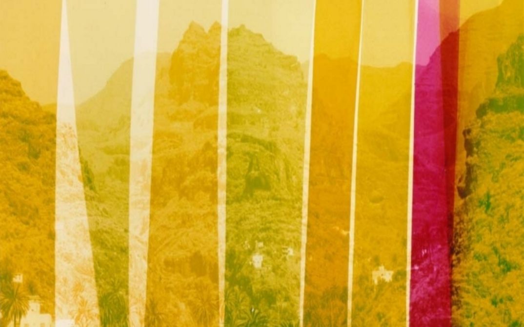Film still from LOST: You can see stripes in various shades of yellow laid over a mountainous landscape.