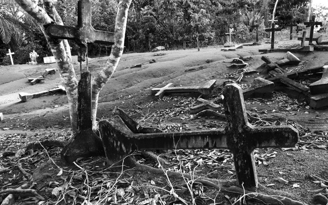 Film still from FORDLANDIA: Fallen crosses in a deserted cemetery.