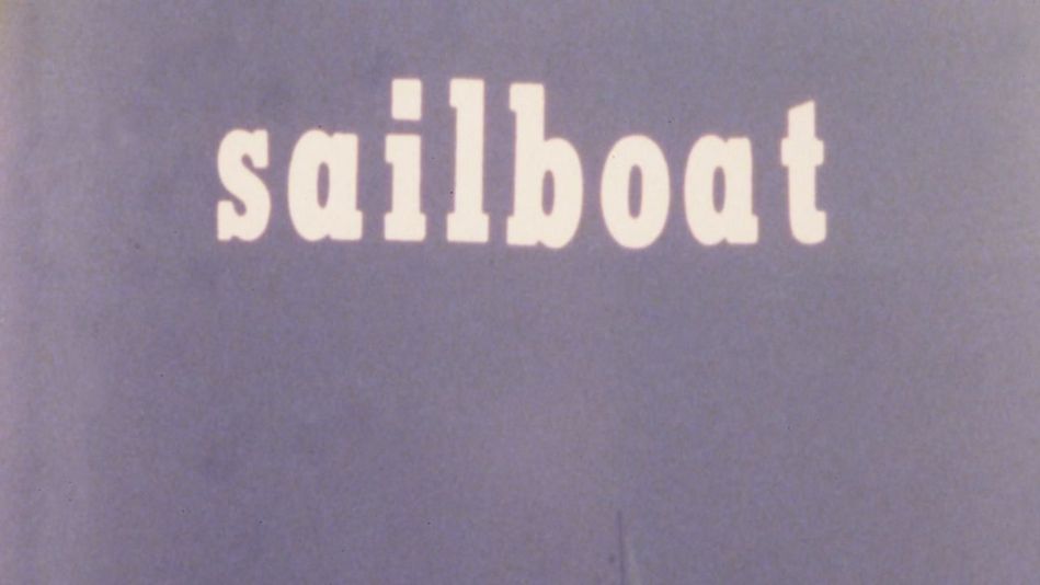 Film still from SAILBOAT: n a monochrome purple image, a sailboat is faintly visible in the background. The words “Sailboat” appear at the top of the image.