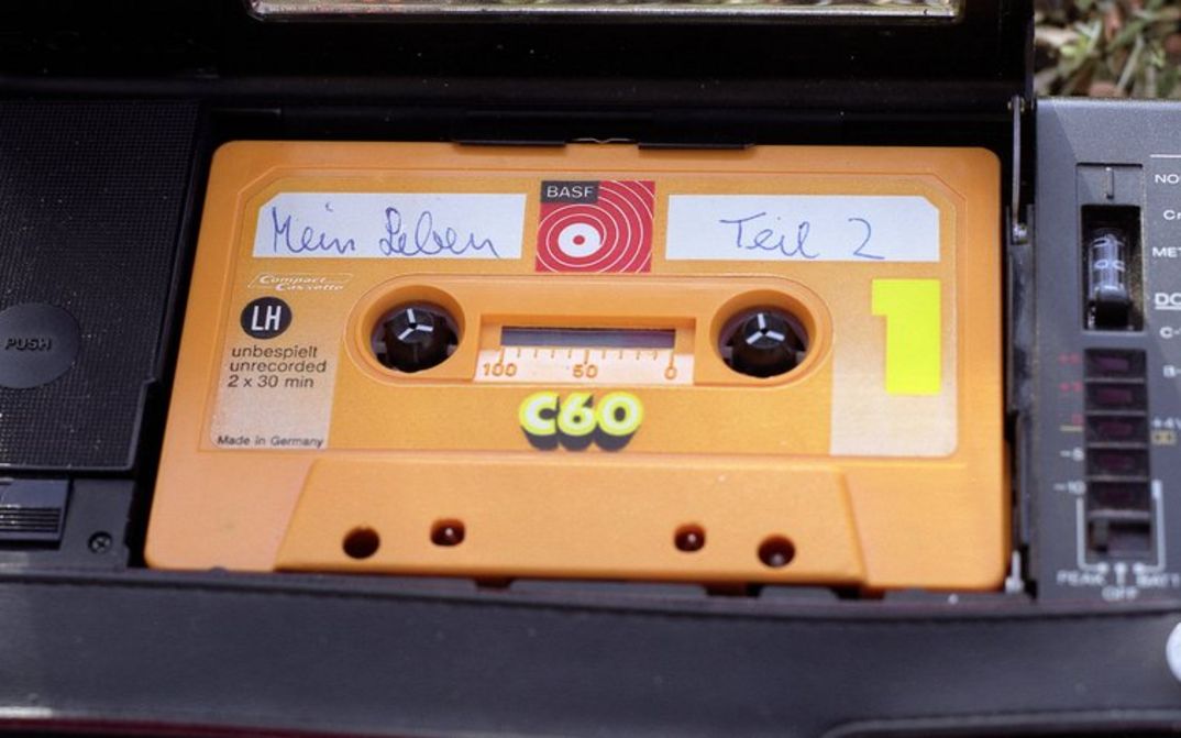 Film still from MEIN LEBEN TEIL 2: An audio cassette labeled "My life part 2".