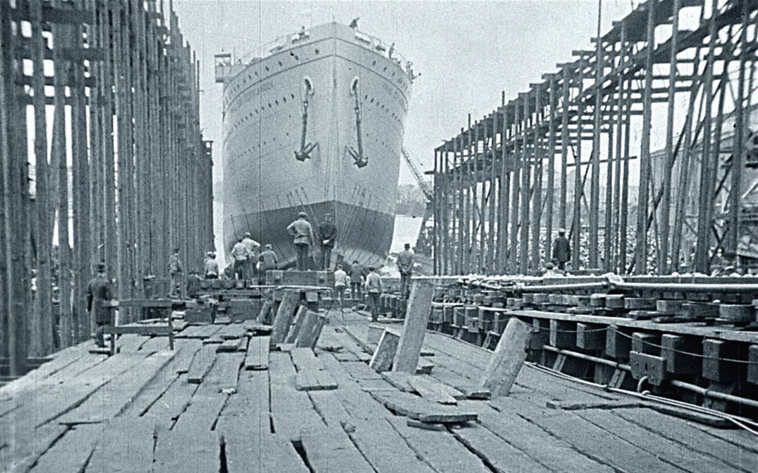 Filmstill from "Dearest Fiona" by Fiona Tan. Old black and white photo from a shipyard.