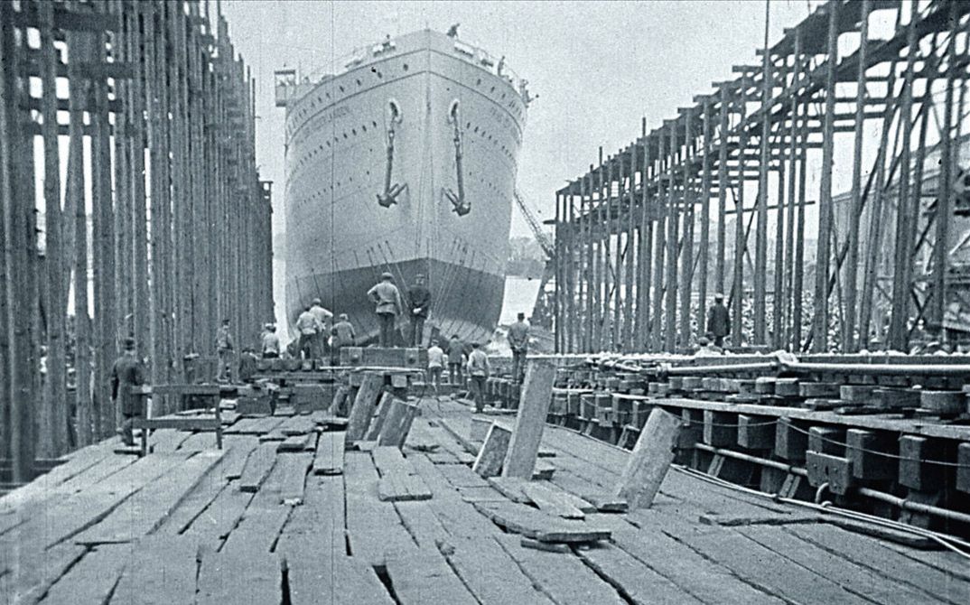 Filmstill from "Dearest Fiona" by Fiona Tan. Old black and white photo from a shipyard.