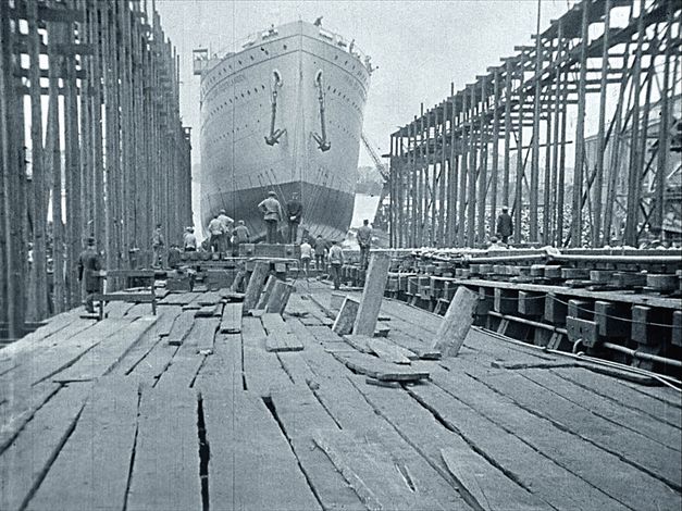 Filmstill from "Dearest Fiona" by Fiona Tan. Old black and white photo from a shipyard.