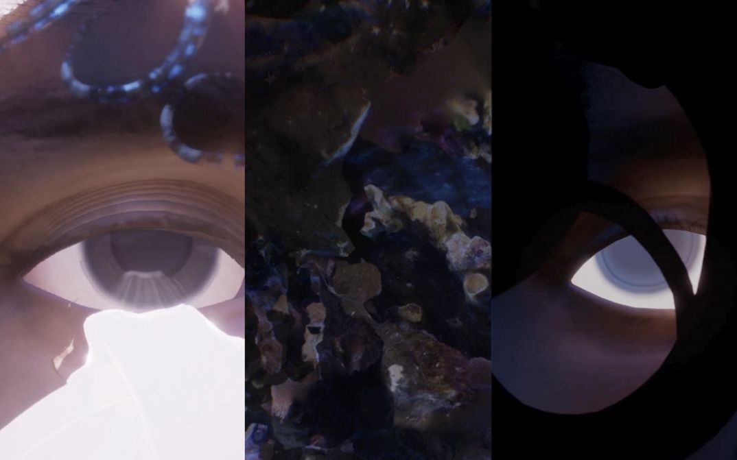 Film still from Jasmina Metwaly’s „On this shore, here.“. An abstract picture, vertically divided into three parts. On the left and the right the form of an eye, to the left in the light, to the right in the dark. In the middle a texture reminiscient of bubbly minerals.