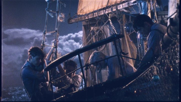 Film still from LES GARÇONS SAUVAGES: A ship in a storm.