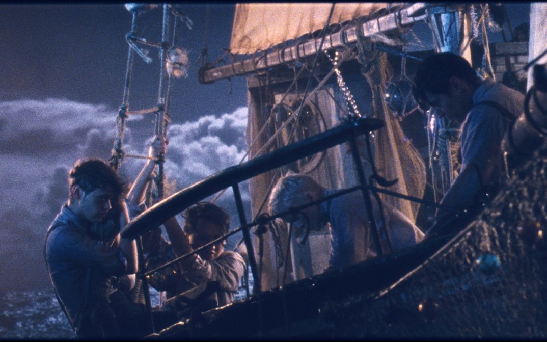 Film still from LES GARÇONS SAUVAGES: A ship in a storm.