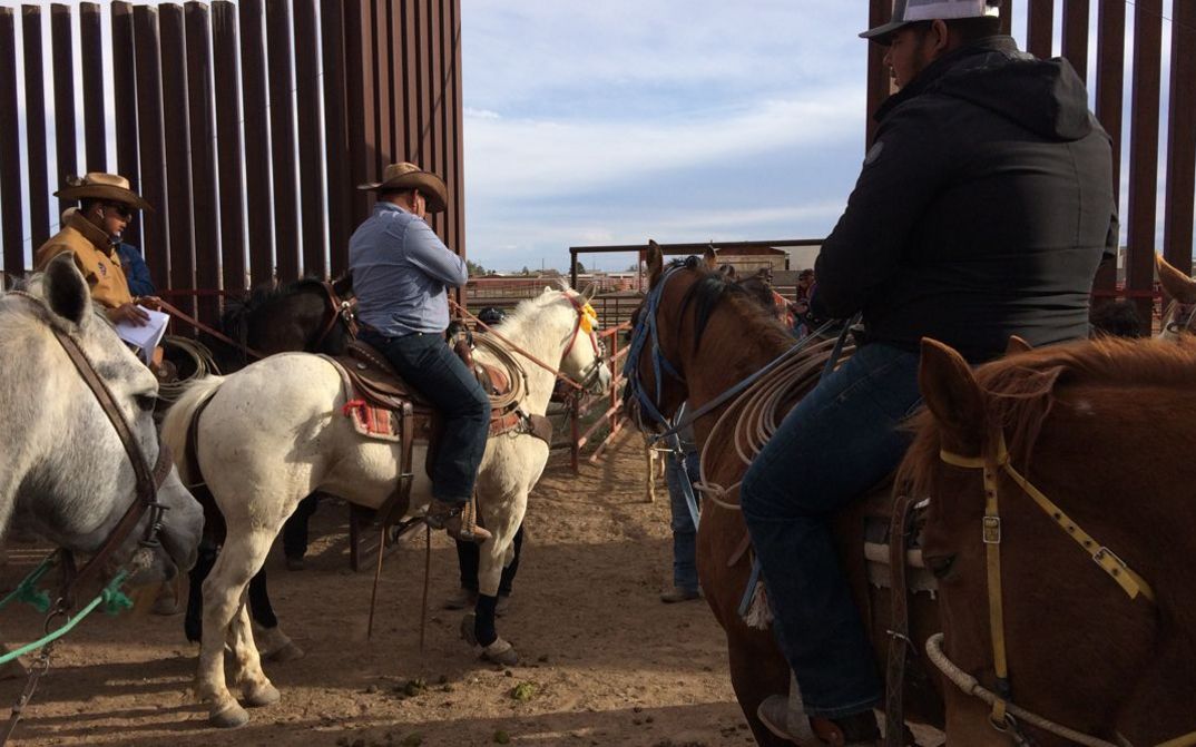 Film still from CROSSING COLUMBUS: Men in cowboy hats on horses.