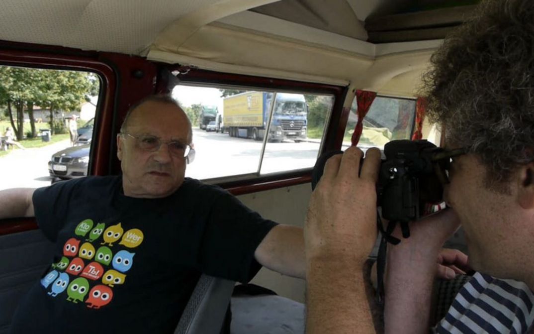 Film still from FATHER AND SON. The filmmaker with his father in a car.
