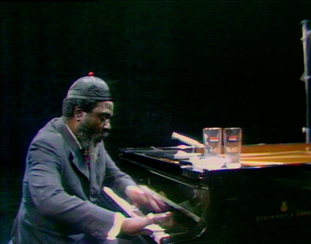 Still from the film “Rewind & Play“. A video image of Thelonious Monk playing the piano in a TV studio.
