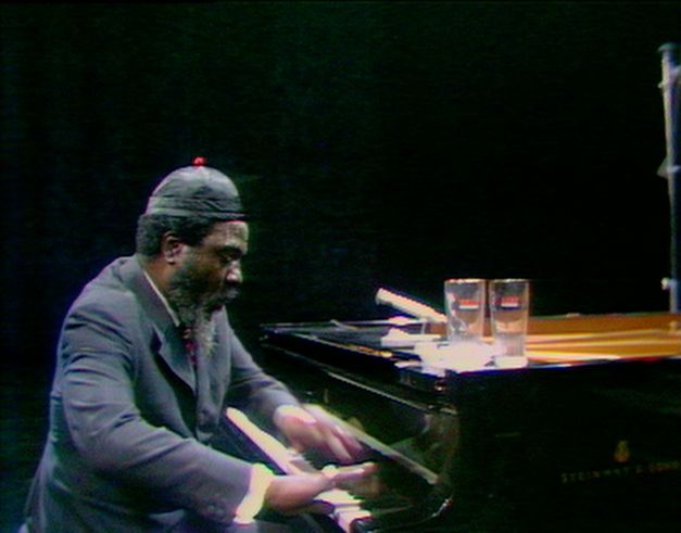 Still from the film “Rewind & Play“. A video image of Thelonious Monk playing the piano in a TV studio.