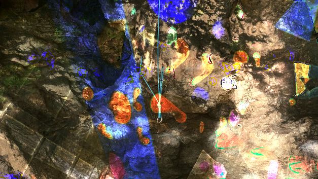 Film still from Chonchanok Thanatteepwong and Pobwarat Maprasob’s film “Mountain Roars”. A kaleidoscope of lights dances across the oversaturated walls of a cave.