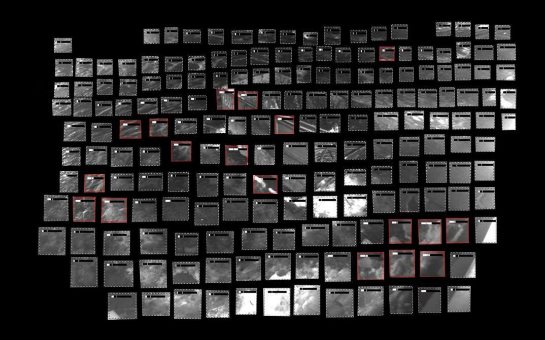Film still from Utkarsh’s film “Remote Occlusions”. A grid of gray rectangles against a black background, which when put together form an indistinct image from a surveillance camera. Some of the rectangles are outlined in red.