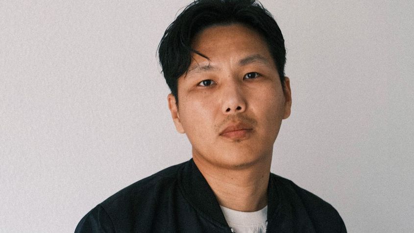 Portrait of Tenzin Phuntsog in white t-shirt and black open jacket