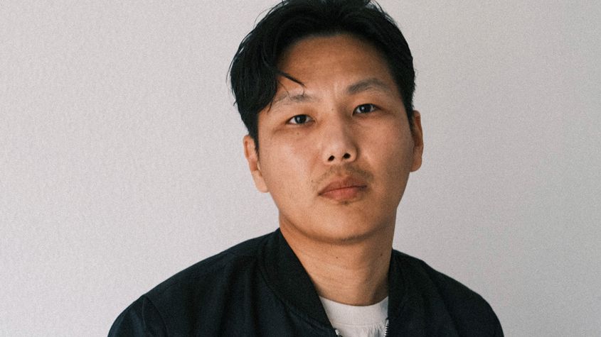 Portrait of Tenzin Phuntsog in white t-shirt and black open jacket