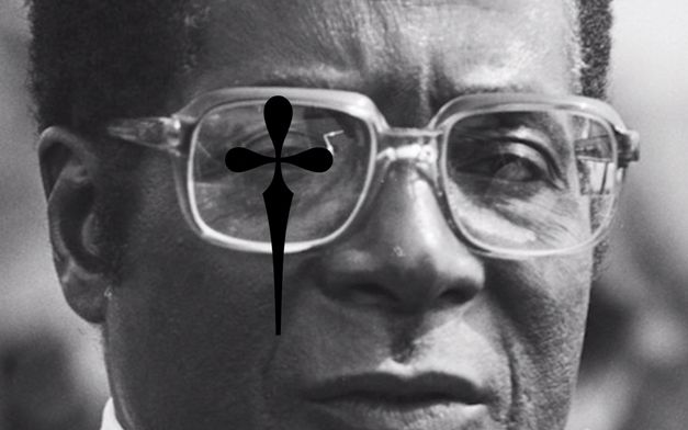 Film still from Heiko-Thandeka Ncube’s „The early rain which washes away the chaff before the spring rains“. A black and white portrait of a person with glasses. A black cross with rounded corners has been digitally laid over the right eye.