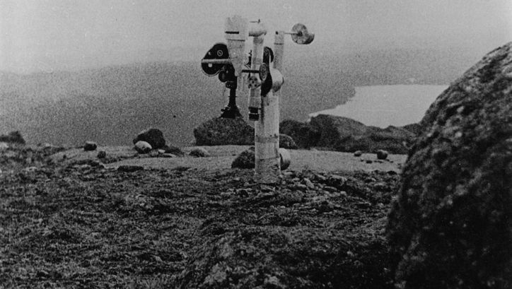 Film still from LA REGION CENTRALE: A tiltable camera in a barren landscape.