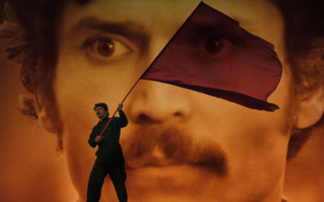 Film still from ULKOMAALAINEN: Collage of a face and a person waving a red flag.