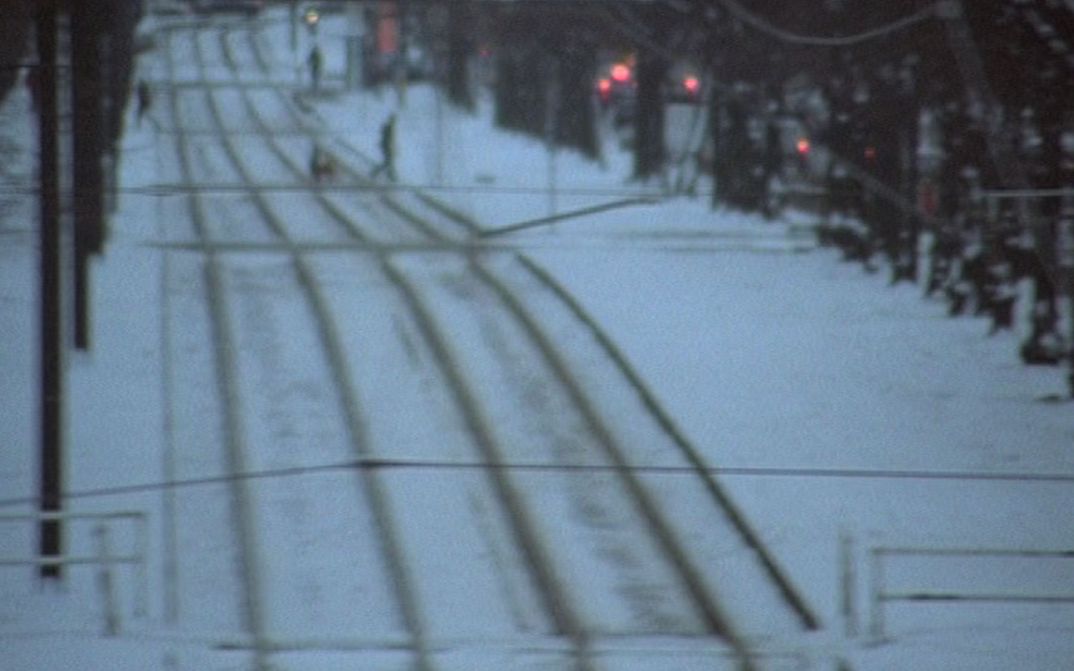 Film still from MATERIAL: Tracks in the snow.