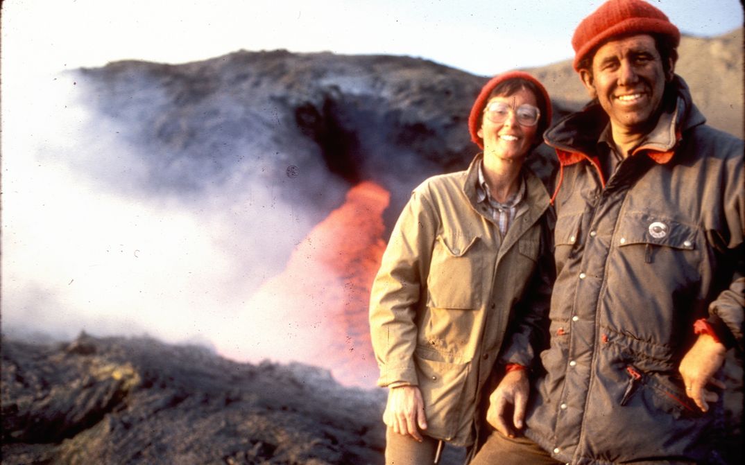 Film still from THE FIRE WITHIN: Maurice and Katja Krafft in front of a volcano.