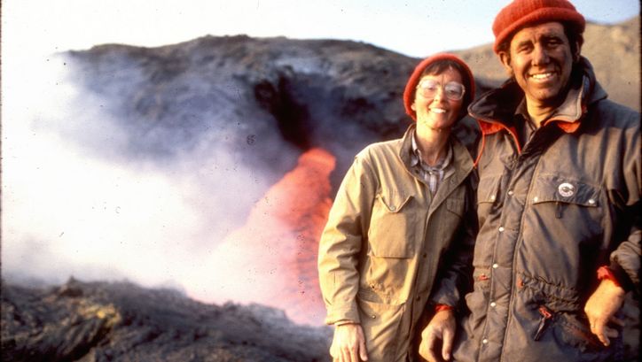 Film still from THE FIRE WITHIN: Maurice and Katja Krafft in front of a volcano.