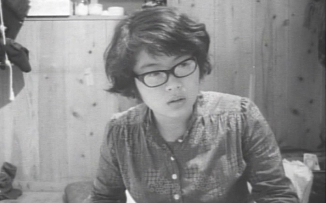 Film stlll from MY VERY PRIVATE EROS, LOVE SONG: A young woman is sitting in a room.