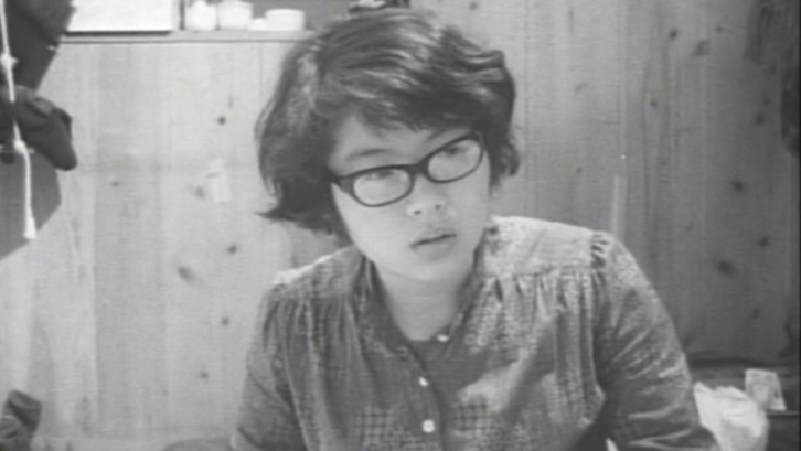 Film stlll from MY VERY PRIVATE EROS, LOVE SONG: A young woman is sitting in a room.