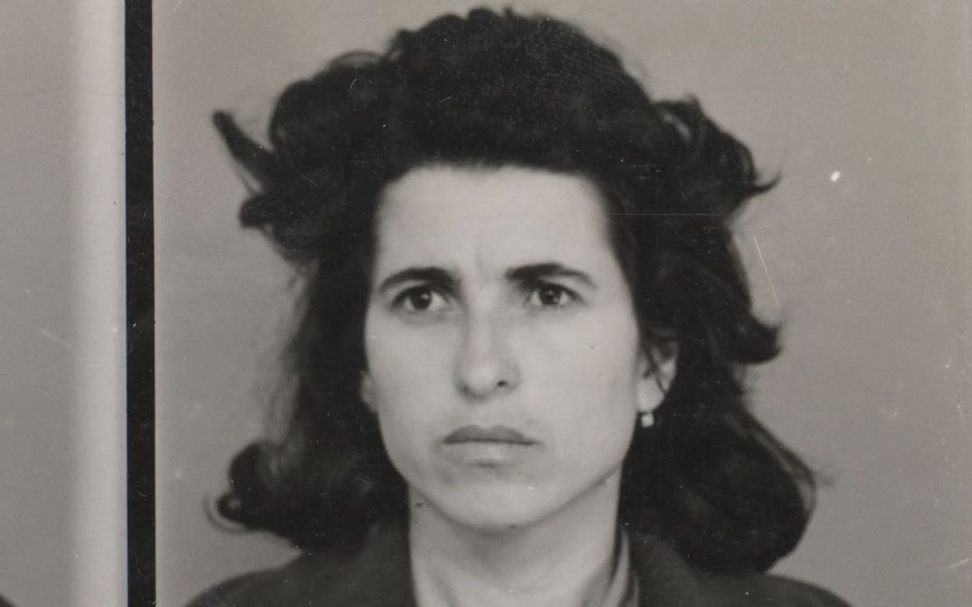 Film still from 48: a portrait shot of a woman with dark hair.
