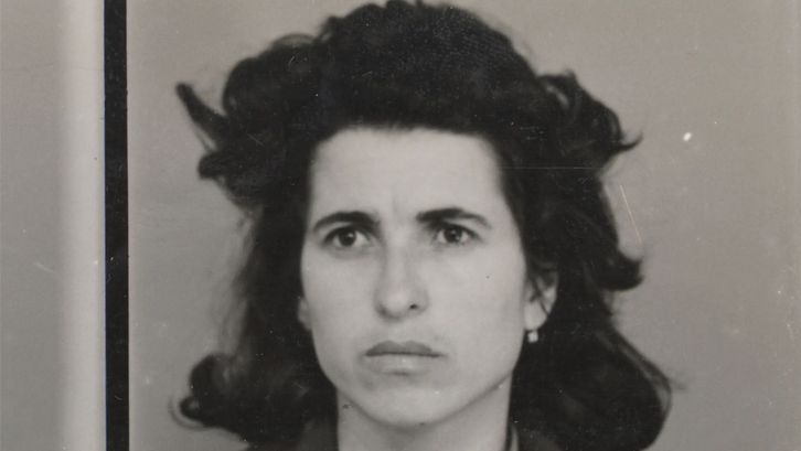 Film still from 48: a portrait shot of a woman with dark hair.