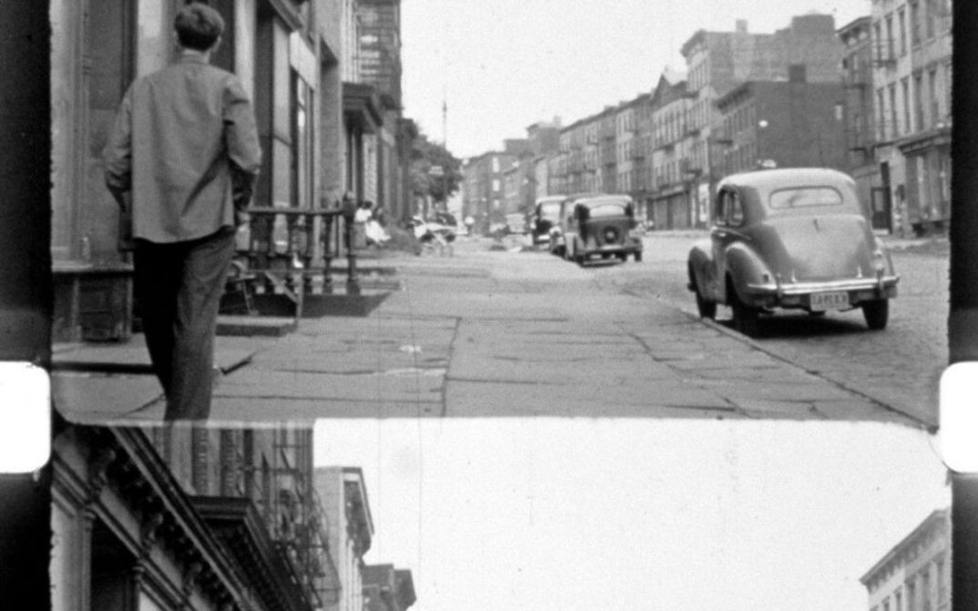 Filmstill aus LOST LOST LOST: Man sieht einen Filmstreifen mit Bildstrich und Perforation; auf dem Filmbild eine Straßenszene aus New York.