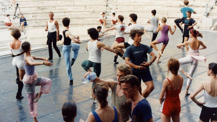 Film still from BALLET. A group of dancers at a rehearsal.