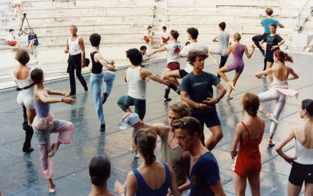 Film still from BALLET. A group of dancers at a rehearsal.