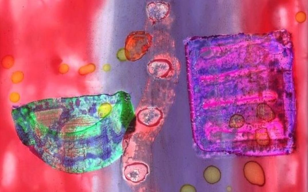 Film still from ALGORITHMEN. A film strip hand painted with different colors and shapes.