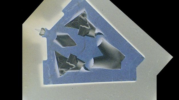 Film still from Crystal Z Campbell’s „Revolver“. An abstract form mirrored along a slanting axis.