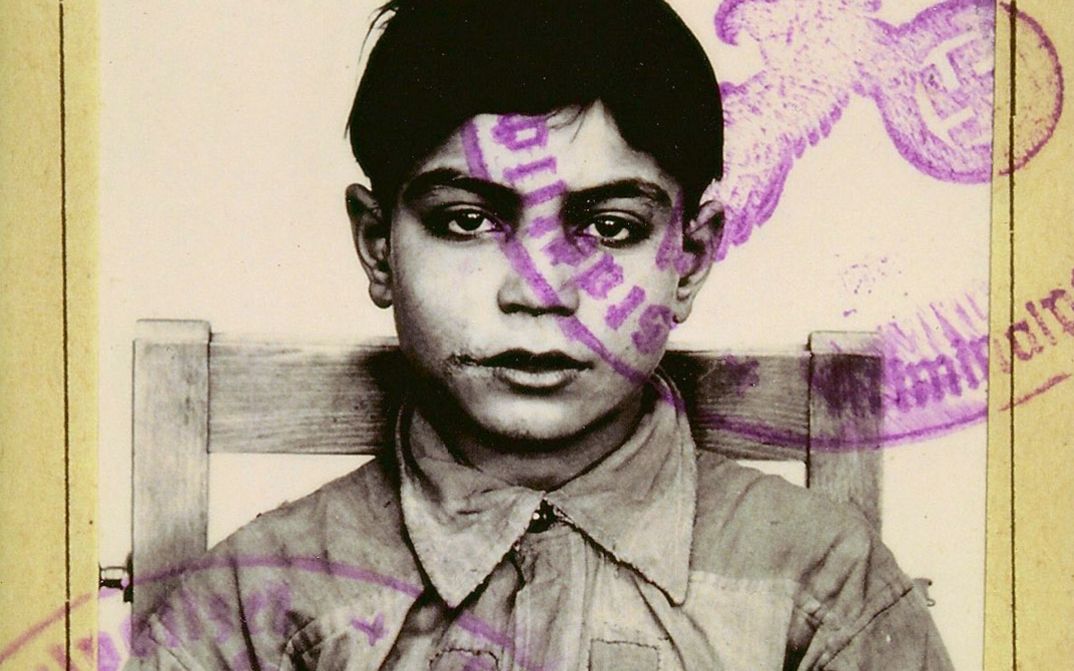 Film still from THE LIE by Melanie Spitta and Katrin Seybold. The picture shows an excerpt from a document. Above the photo of a Sinti boy is the stamp of the criminal investigation department with a swastika and the handwritten date January 30, 1943. 