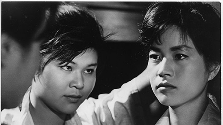 Film still from ONNA BAKARI NO YORU: Three people looking at each other.