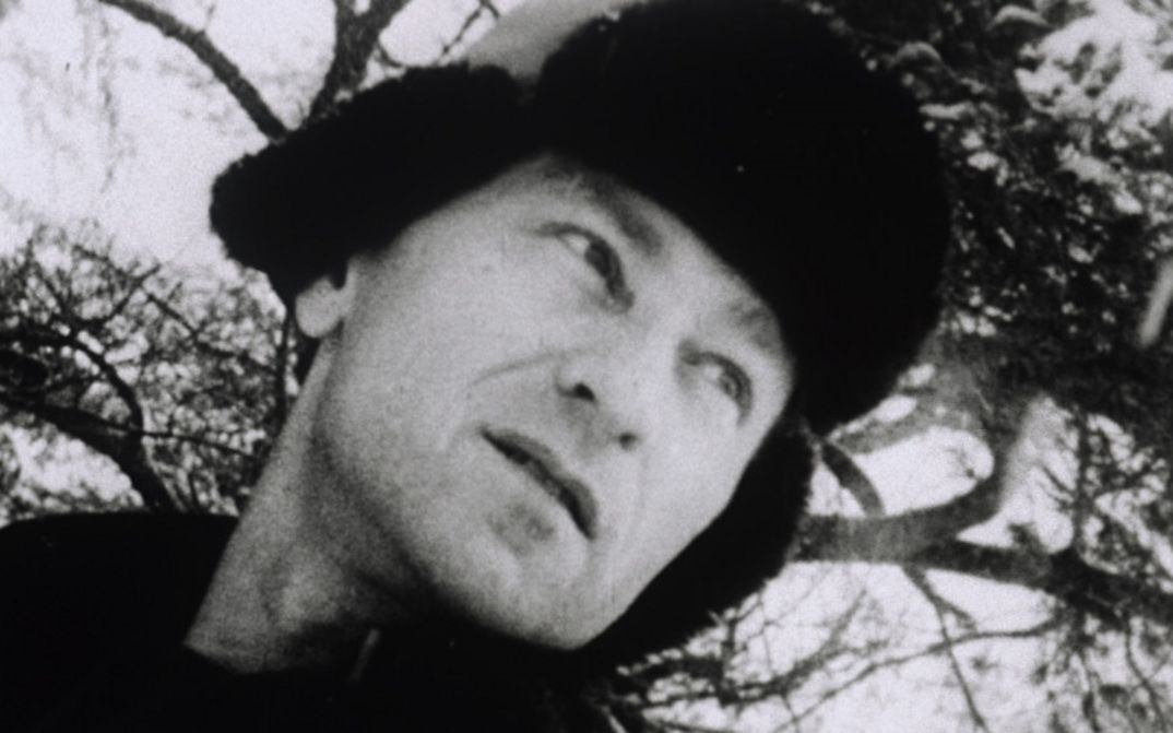 Film still from LOST LOST LOST. You can see Jonas Mekas in a fur hat, looking pensively into the distance.