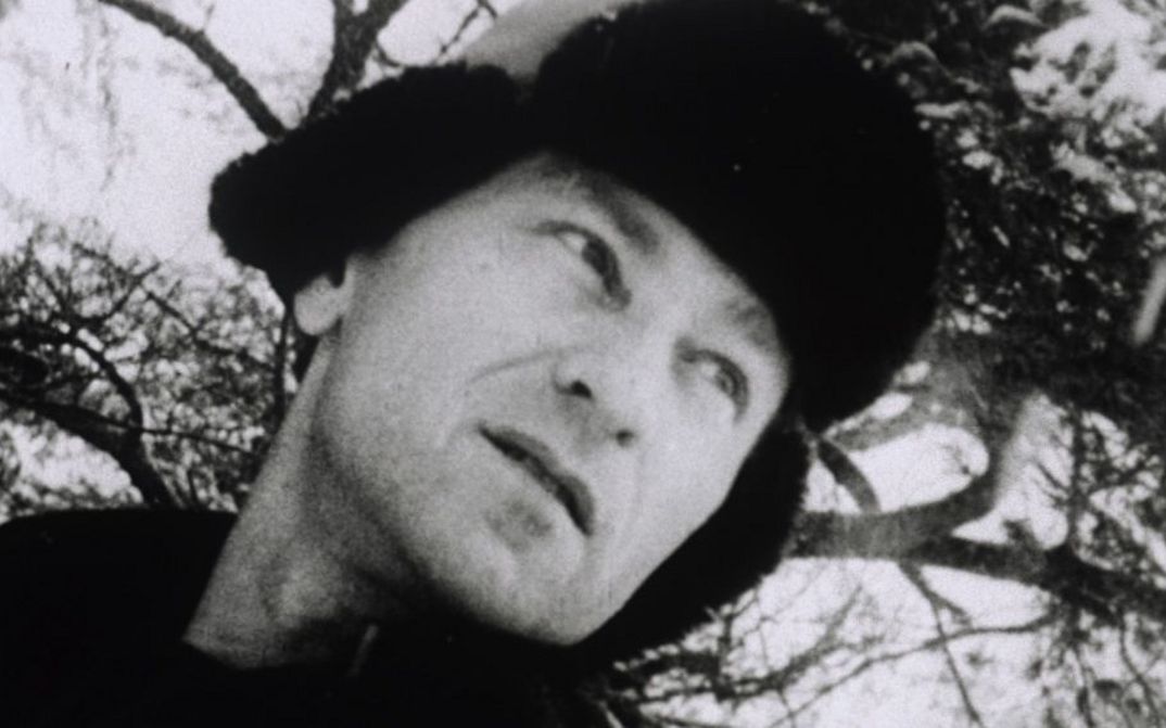 Film still from LOST LOST LOST. You can see Jonas Mekas in a fur hat, looking pensively into the distance.