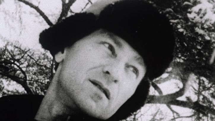Film still from LOST LOST LOST. You can see Jonas Mekas in a fur hat, looking pensively into the distance.