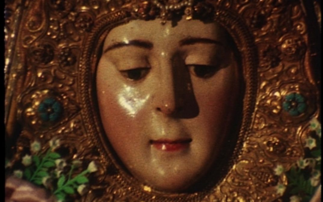 Film still from ROCÍO: View of a statue of a saint.