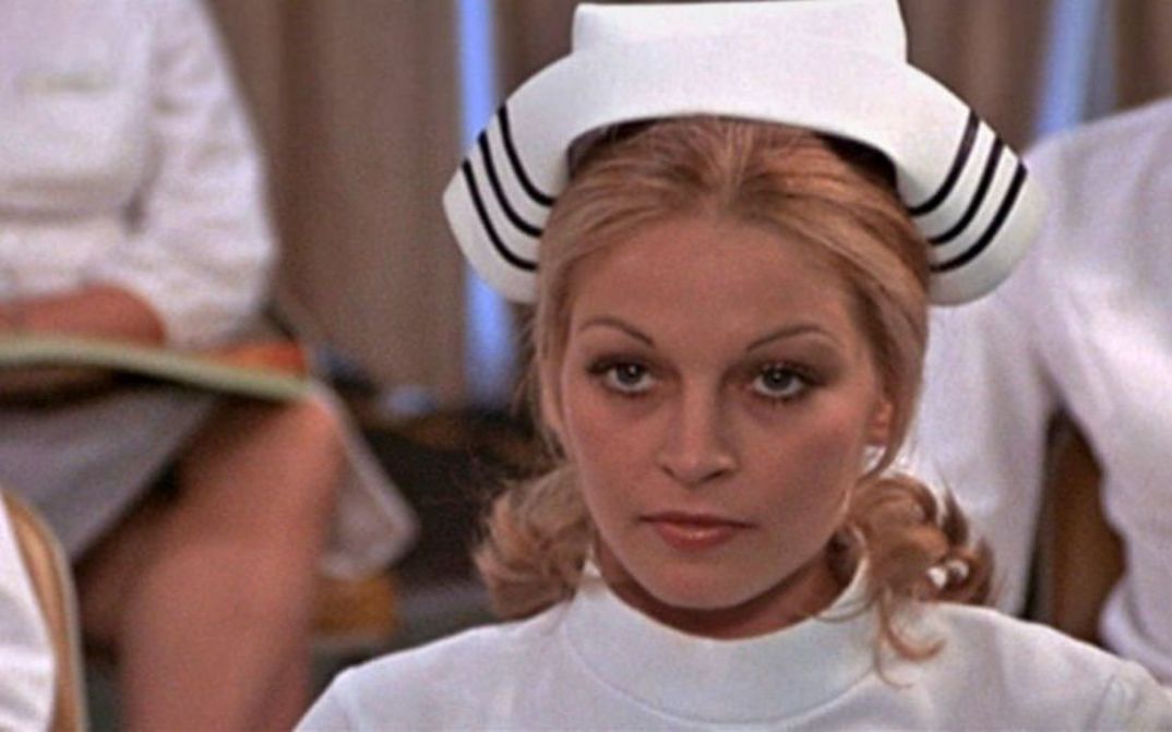 Film still from THE STUDENT NURSES: Young nurses in a classroom.