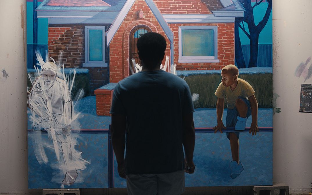 Film still from EXHIBITING FORGIVENESS: You see a person from behind, standing directly in front of a large painting.